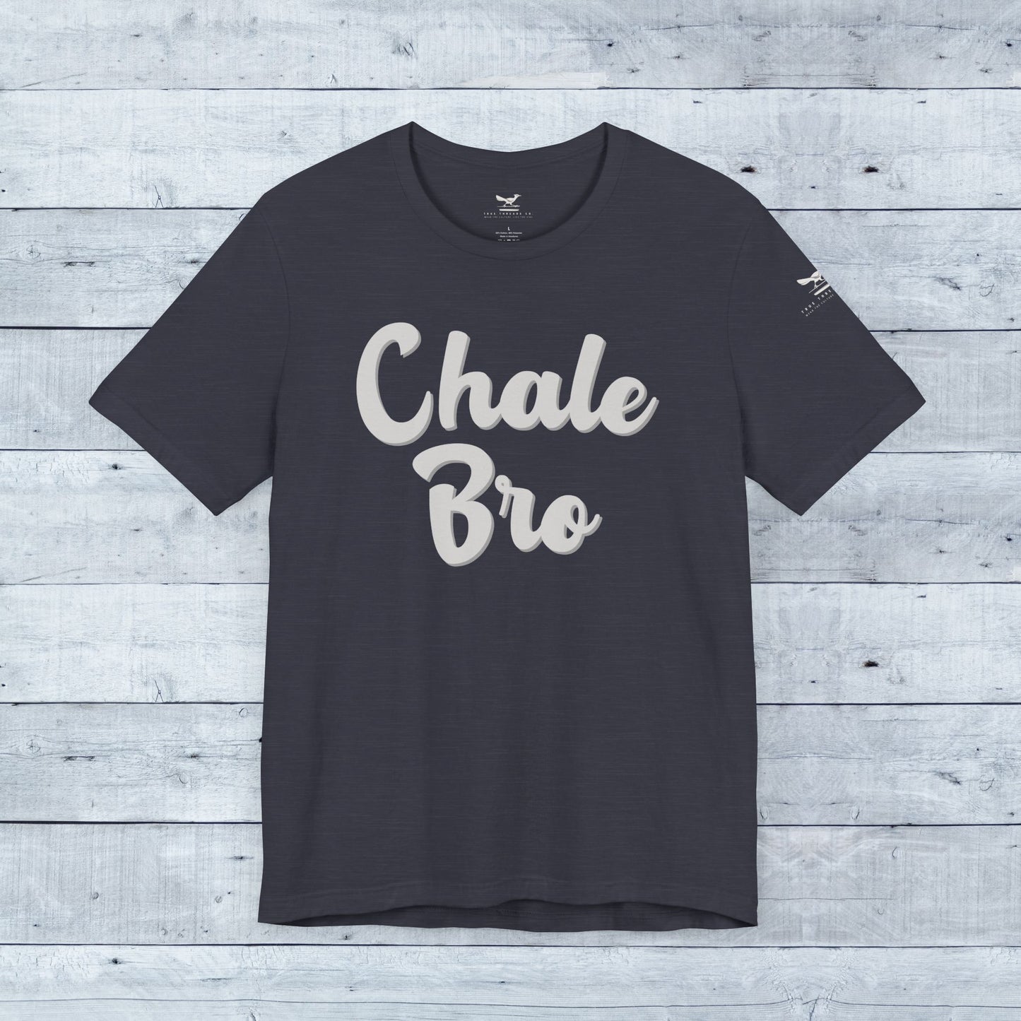 Dark grey heather unisex tee with white "Chale Bro" playful slogan and relaxed fit.