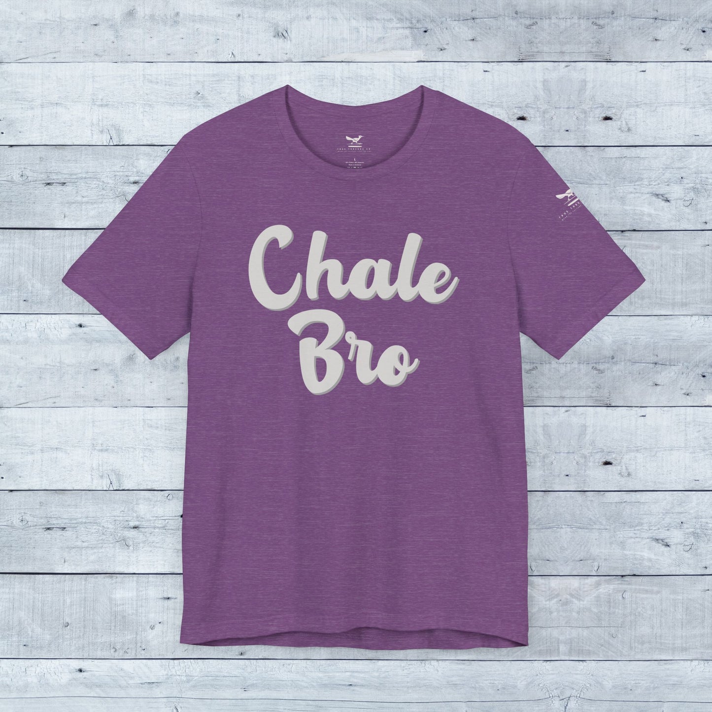 Heather team purple crew neck t-shirt with playful "Chale Bro" white script slogan on front.
