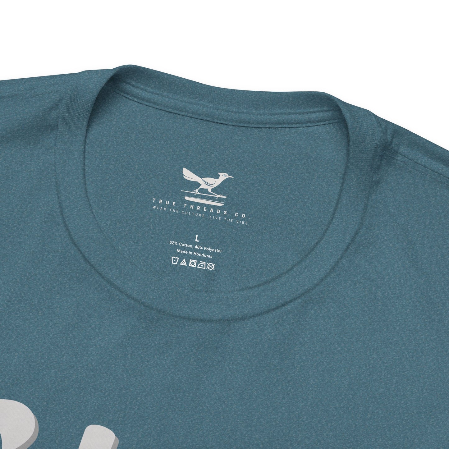 Heather deep teal crew neck Bella Canvas tee with subtle white printed text inside collar.