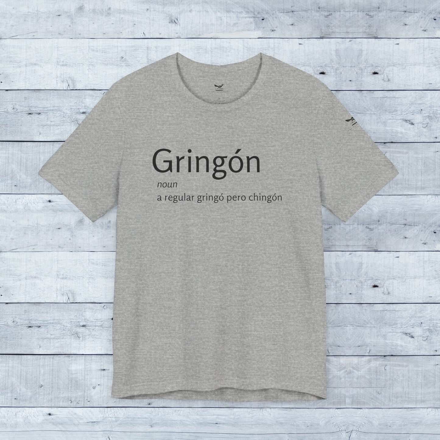 Gringón Tee: Grey t-shirt with bold black text, crafted from soft tri-blend fabric, offering comfort and style for both casual and semi-formal occasions.