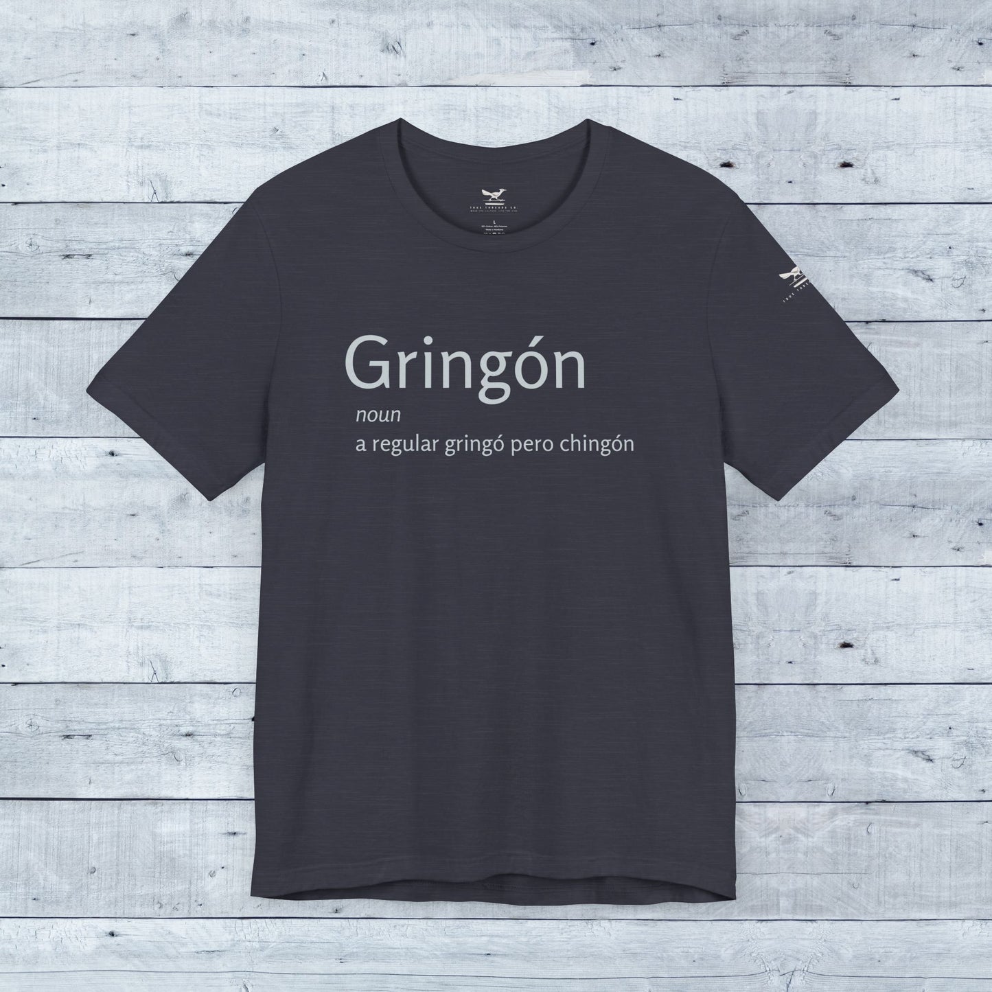 Close-up of the Gringón Tee, featuring bold white text on a black background, crafted from soft tri-blend fabric for comfort and style.