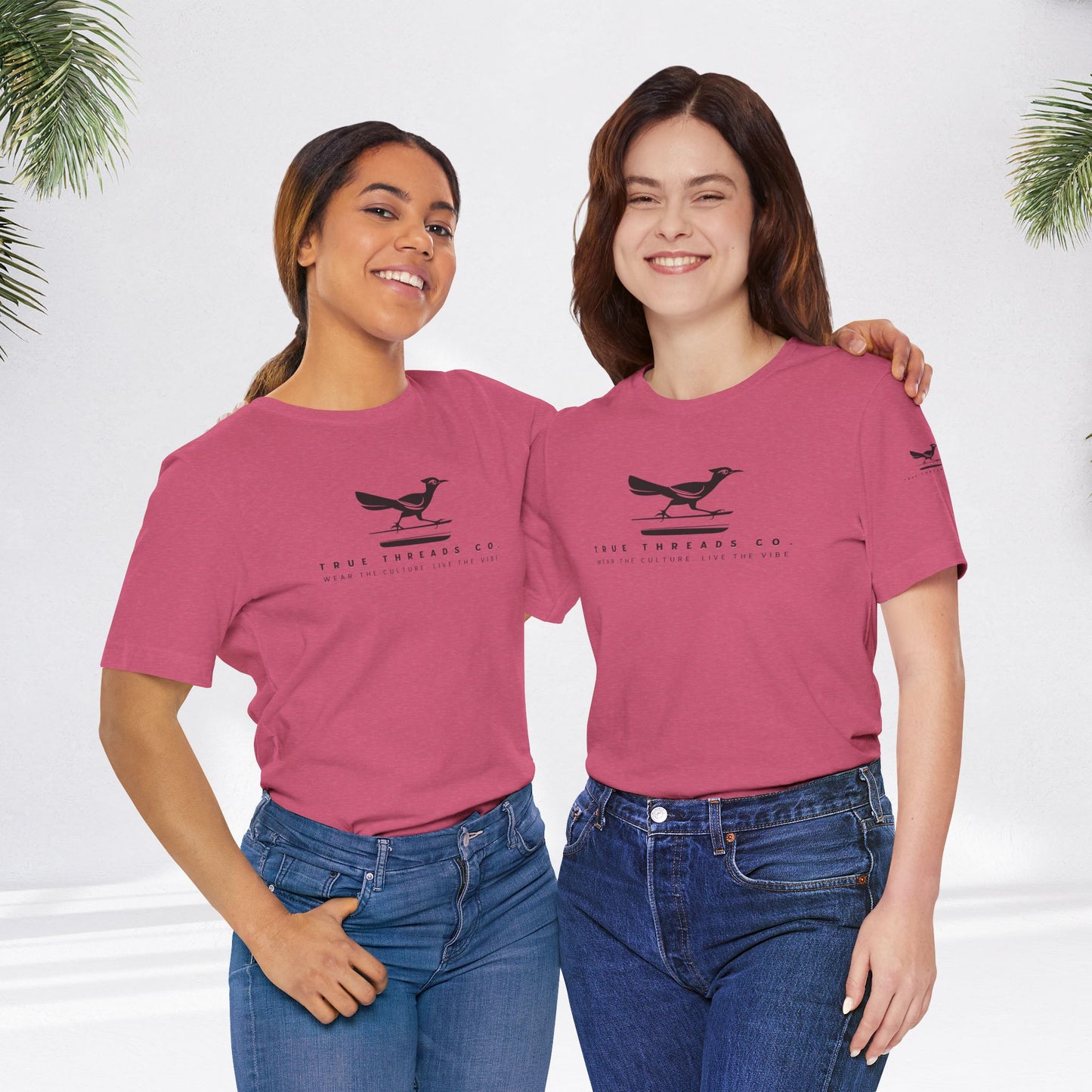 Person in jeans wearing True Threads Classic Tee, showcasing relaxed fit and ribbed collar. Smiling, embodying comfort and style from True Threads Co.'s collection.
