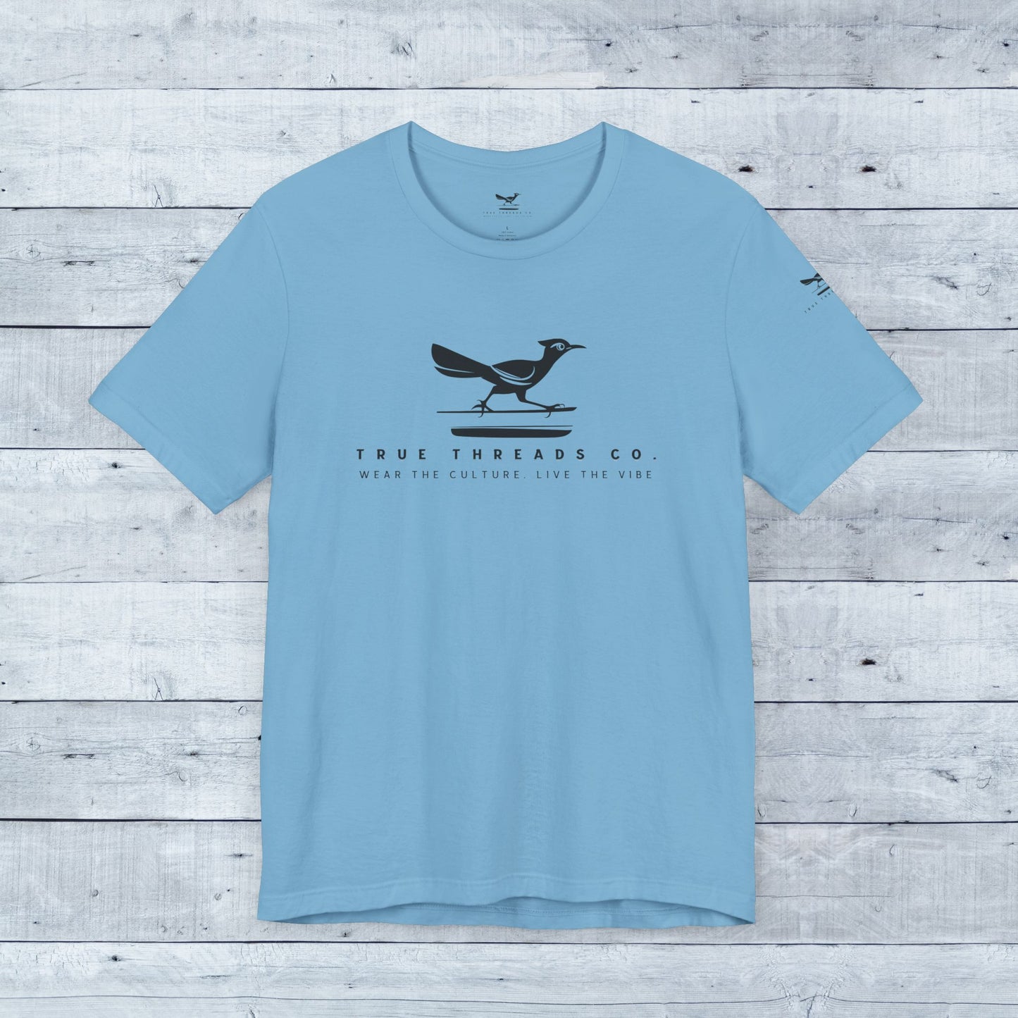 True Threads Classic Tee (Light Colors) featuring a bird, crafted from soft tri-blend fabric, offers a relaxed unisex fit with ribbed collar and shoulder taping.