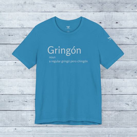 Gringón Tee: Blue shirt with bold white text, showcasing a fusion of cultures. Soft tri-blend fabric, unisex fit, perfect for confident, stylish wear.