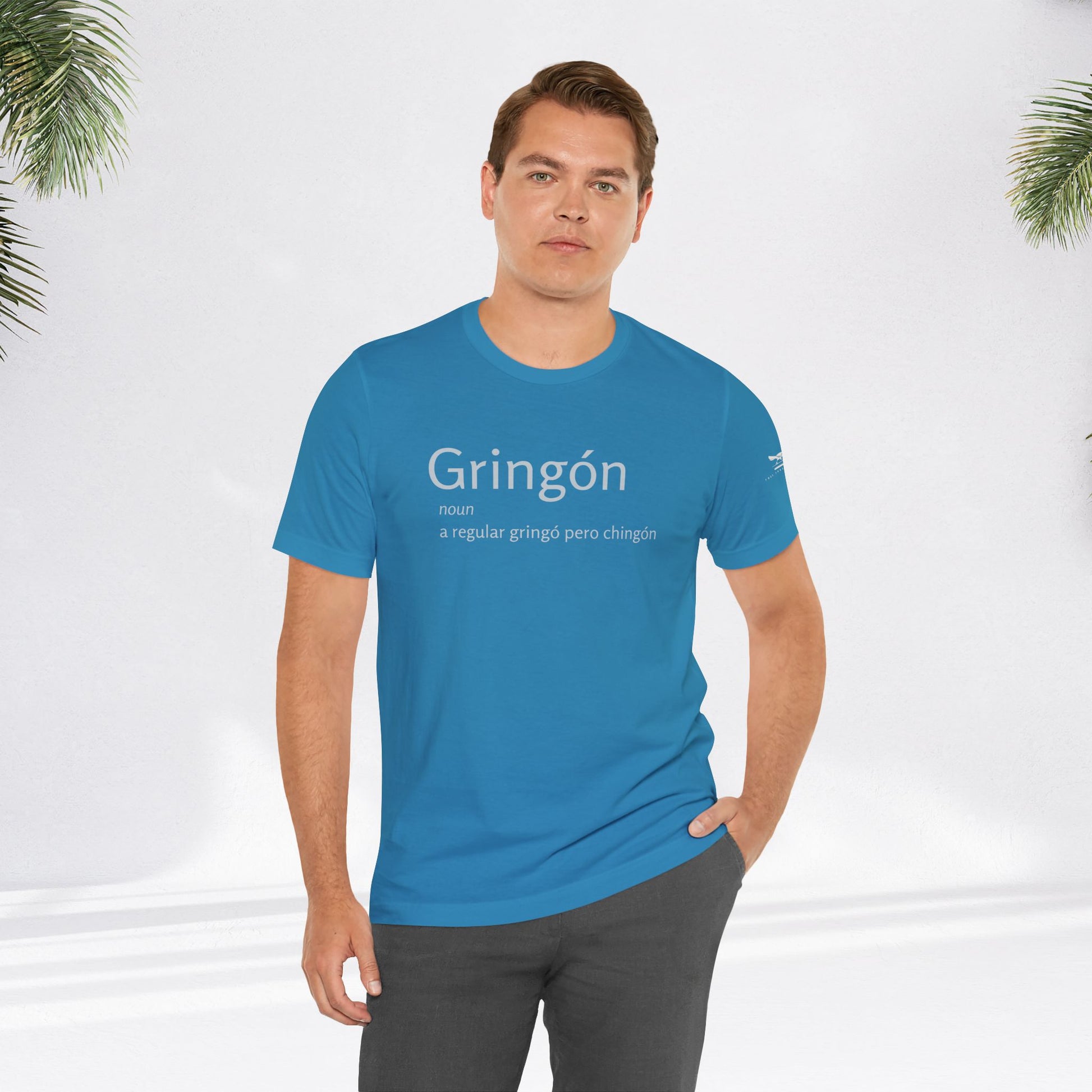 Man wearing blue Gringón Tee, showcasing its comfortable fit and stylish design, reflecting a bold fusion of cultures and confident attitude.