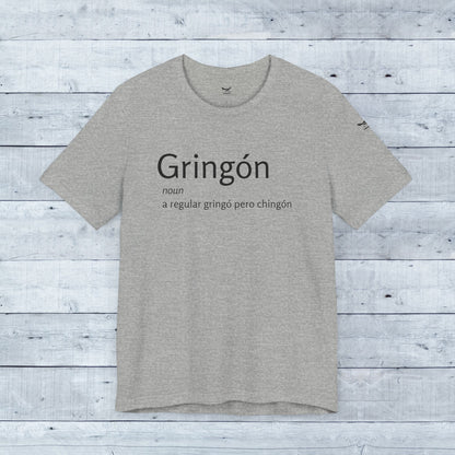 Gringón Tee: Grey t-shirt with bold black text, crafted from soft tri-blend fabric, offering comfort and style for both casual and semi-formal occasions.