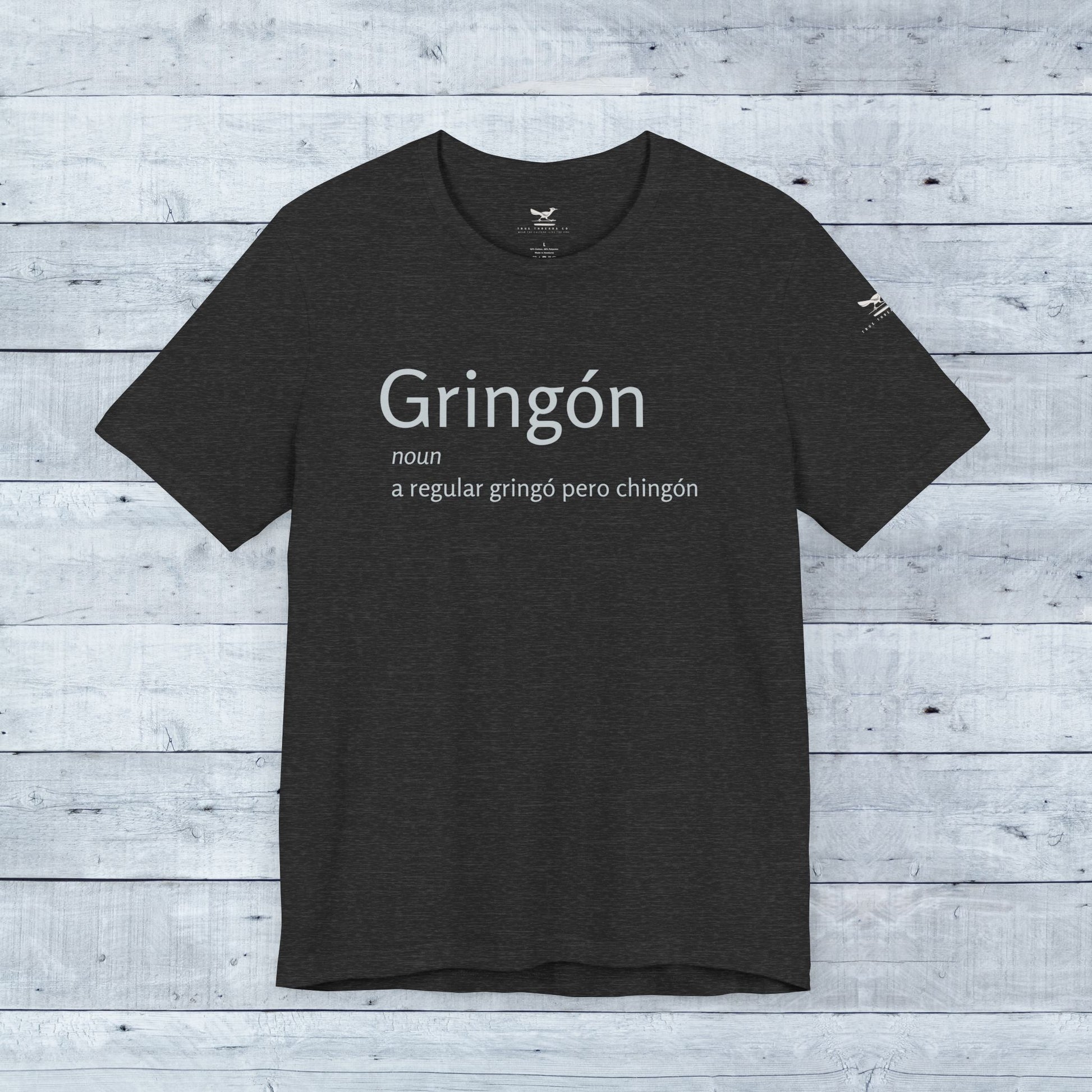 Gringón Tee: Black tee with bold white text, showcasing cultural fusion and confidence. Soft tri-blend fabric, unisex crew neck, perfect for casual or semi-formal wear.