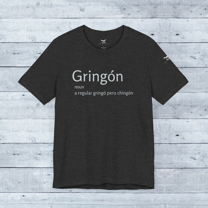 Gringón Tee: Black tee with bold white text, showcasing cultural fusion and confidence. Soft tri-blend fabric, unisex crew neck, perfect for casual or semi-formal wear.