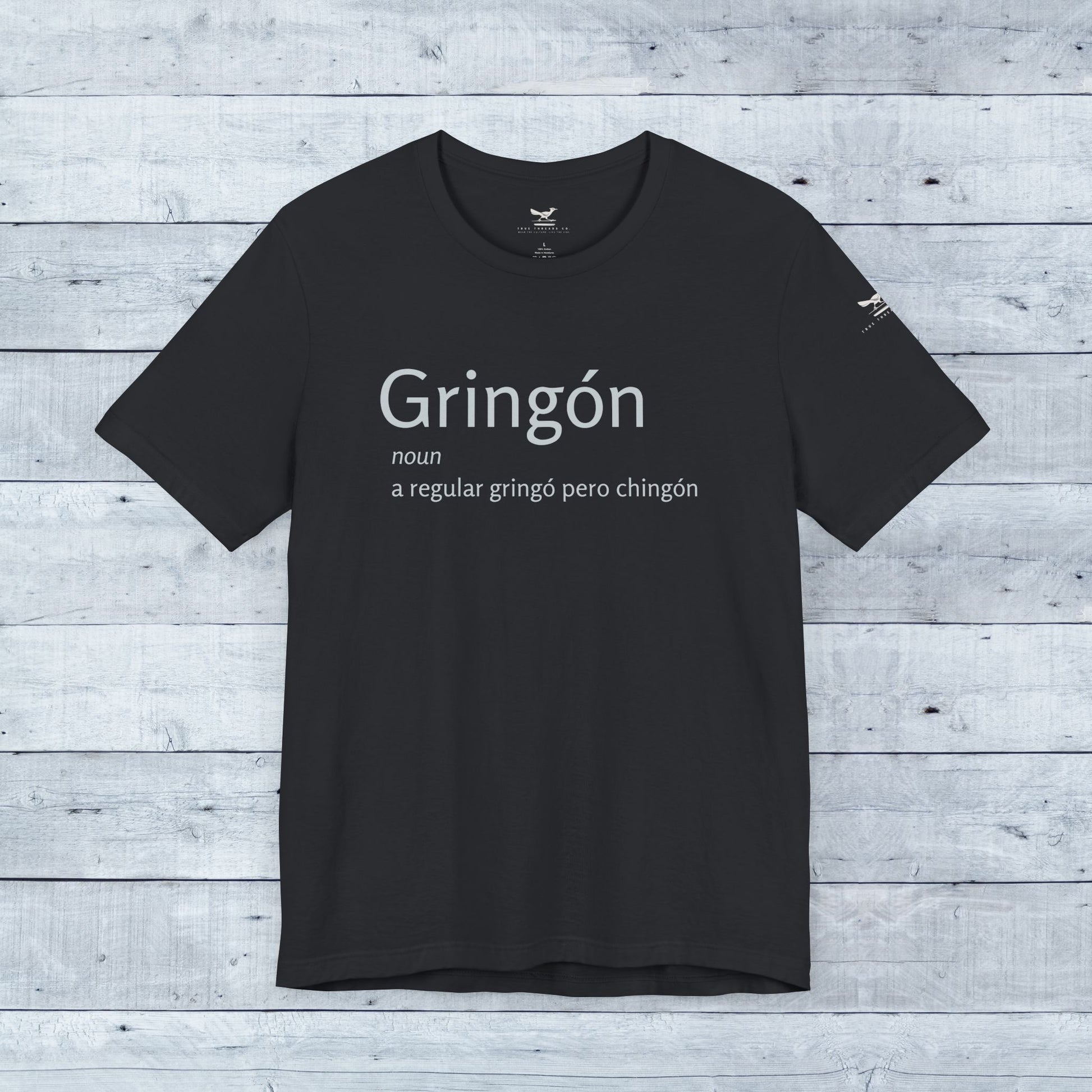 Close-up of the Gringón Tee, a black t-shirt with bold white text, embodying cultural fusion and confidence for any casual or semi-formal setting.