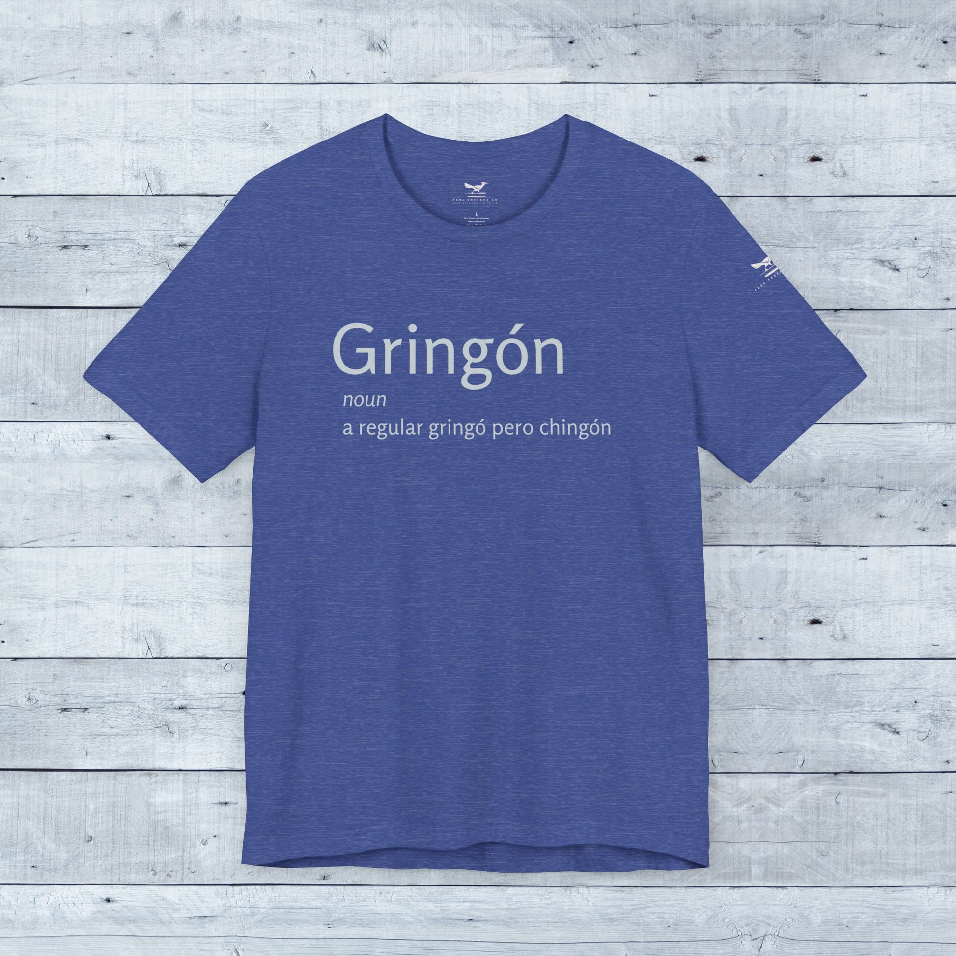 Gringón Tee showcasing bold white text on a blue t-shirt, crafted for comfort and style with a unisex fit and tear-away label.