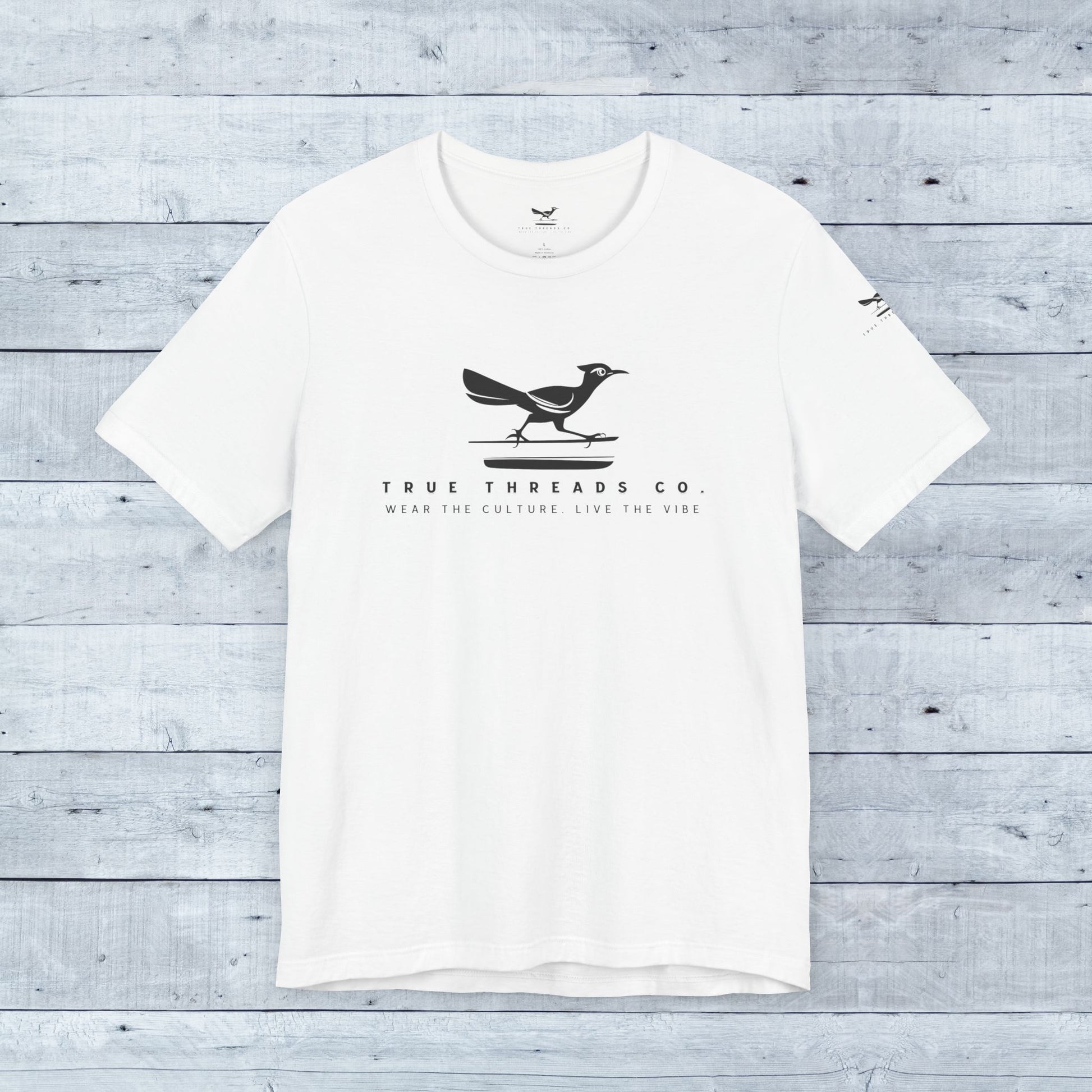 True Threads Classic Tee (Light Colors) featuring a bird design, crafted from ultra-soft tri-blend fabric with a relaxed unisex fit and ribbed collar.